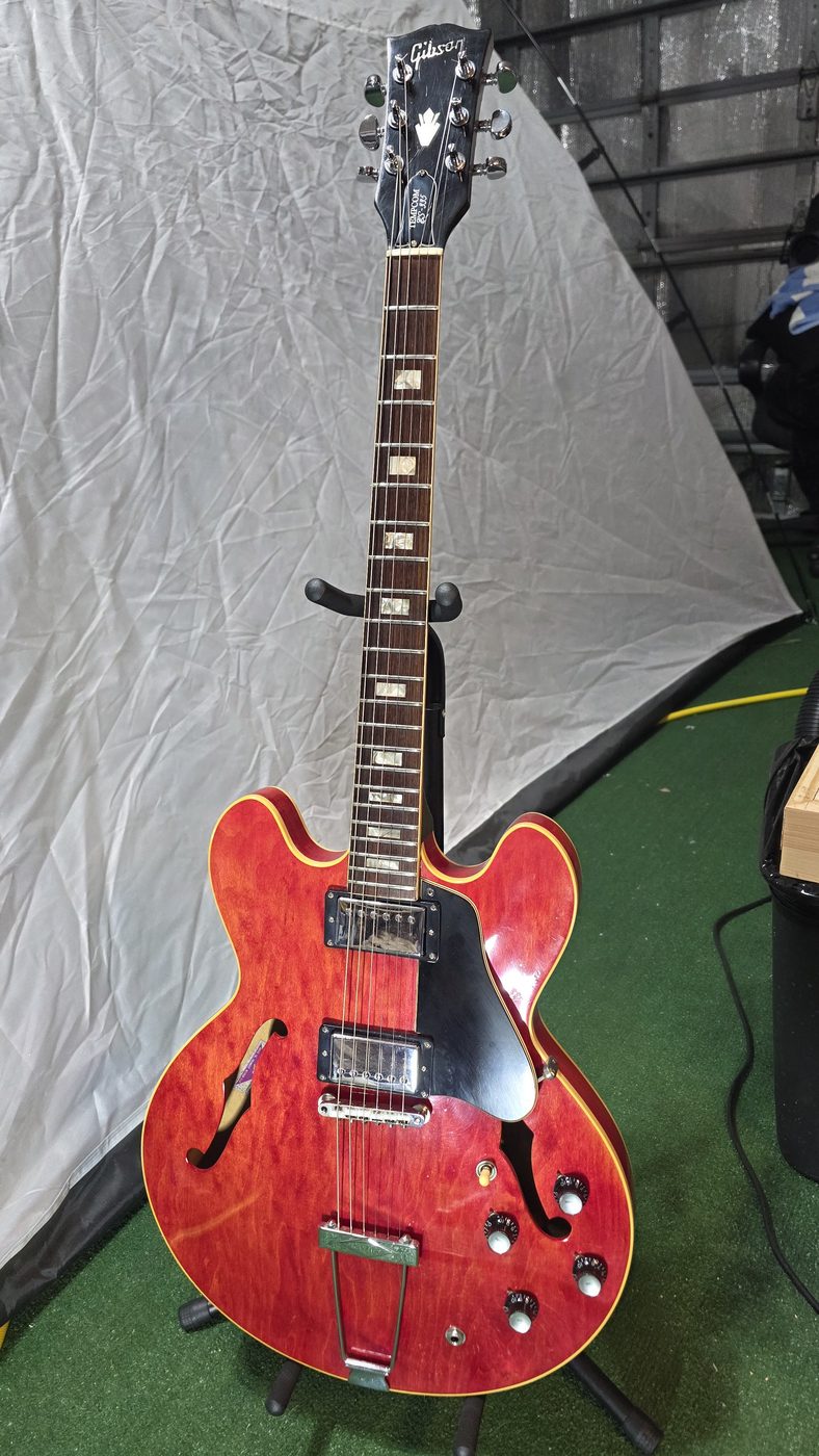 Cherry red semi-hollow guitar restoration with Tempcom branding