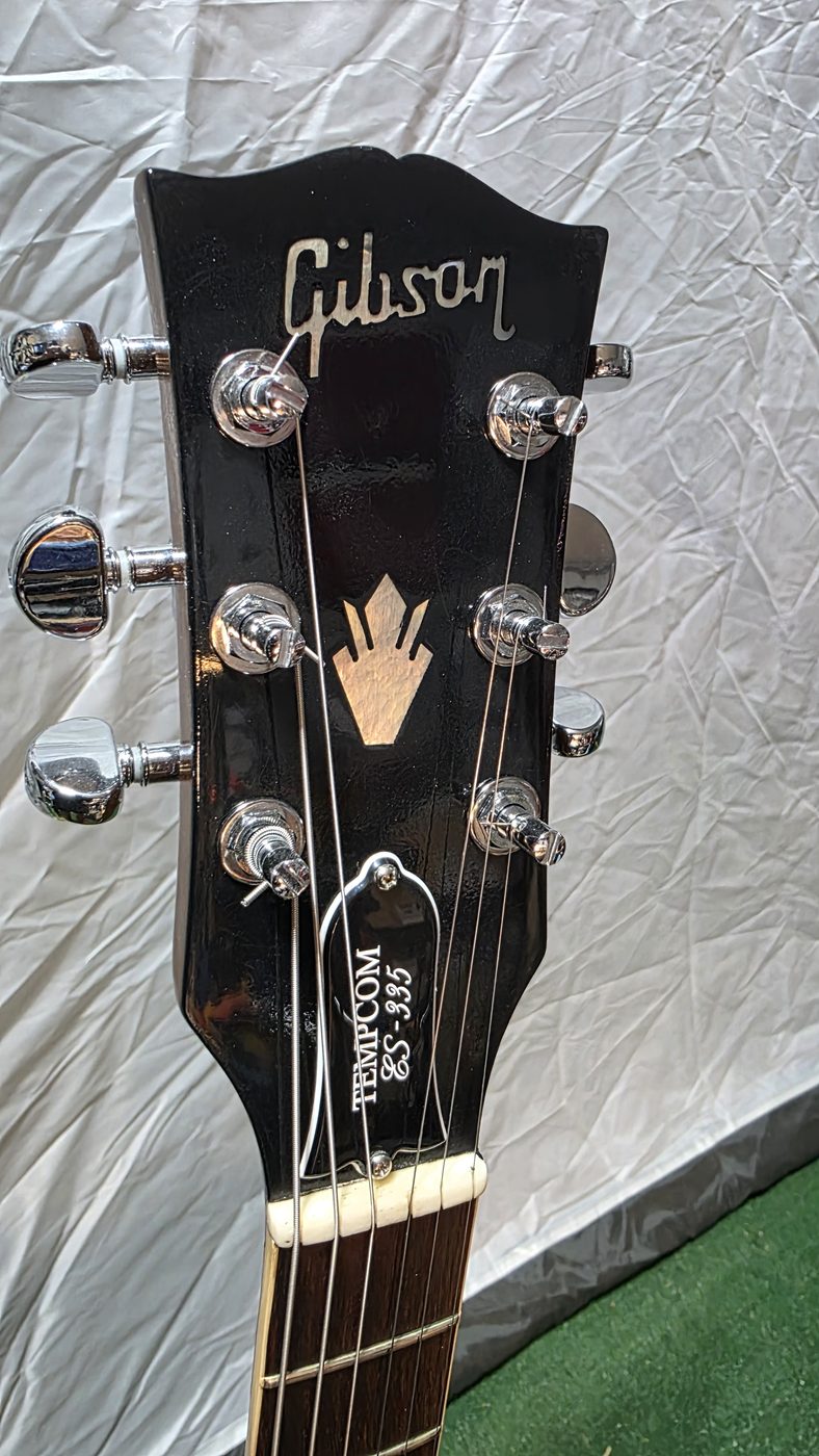 Gibson SG headstock with custom Tempcom GS-335 engraving